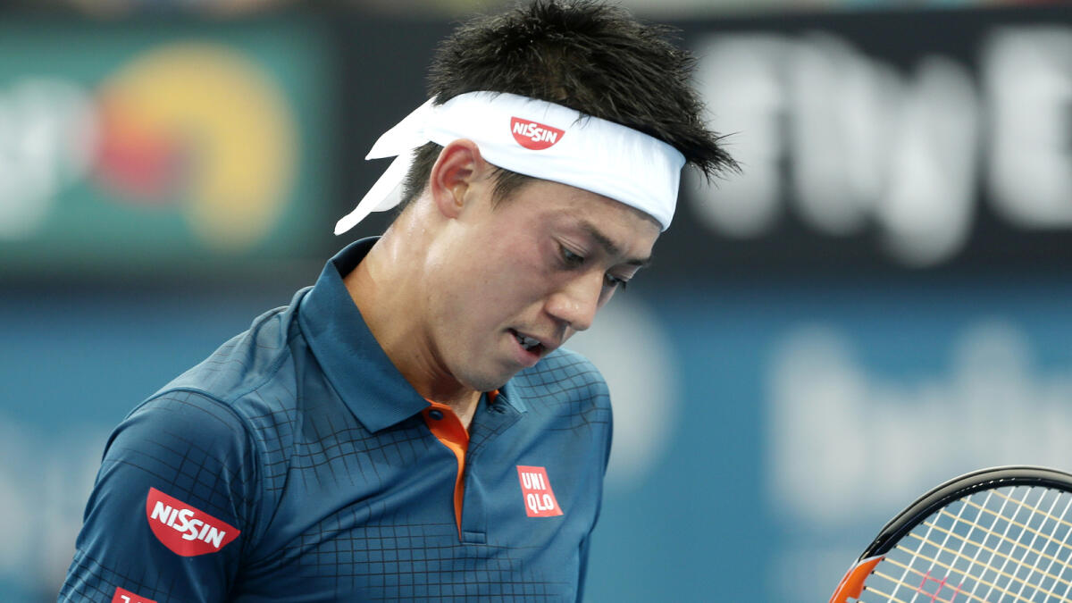 Kei Nishikori of Japan reacts after winning a point in his match against Mikhail Kukushkin of Kazakhstan in Brisbane 