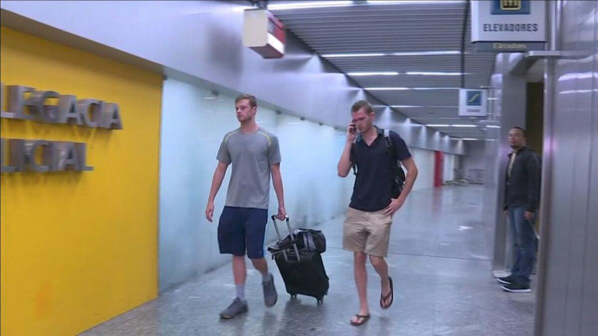 US swimmers pulled off plane in Rio amid robbery probe