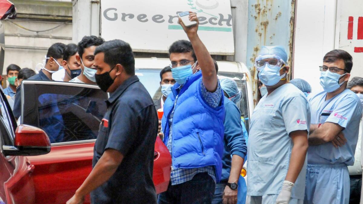 BCCI president Sourav Ganguly (centre) waves to his fans after being released from Woodlands Hospital in Kolkata on Friday. (PTI)