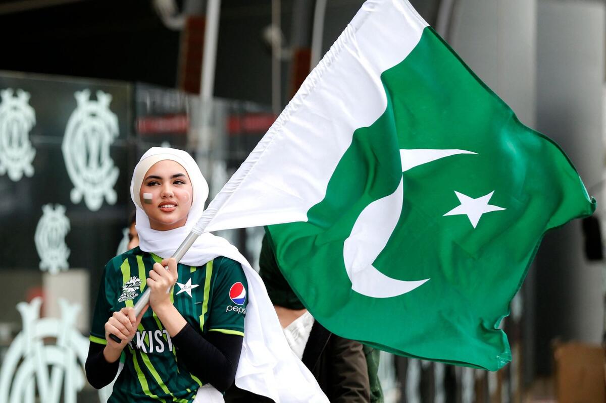 A Pakistan fan holds the flag. — Melbourne Cricket Ground Twitter