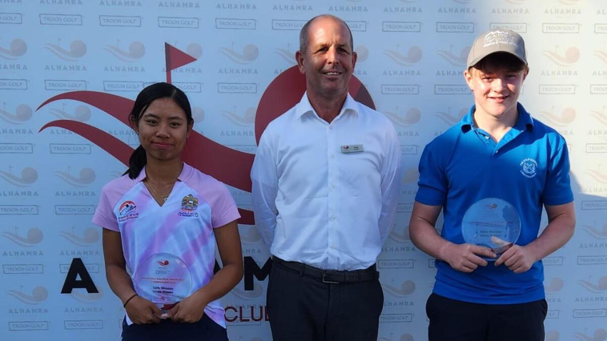 Winners of the UAE World Amateur Junior Championship in Ras Al Khaimah, Jamie Camero (left) and Cameron Mukherjee (right) with General Manager of Al Hamra Golf Club, Paul Booth. - Supplied photo