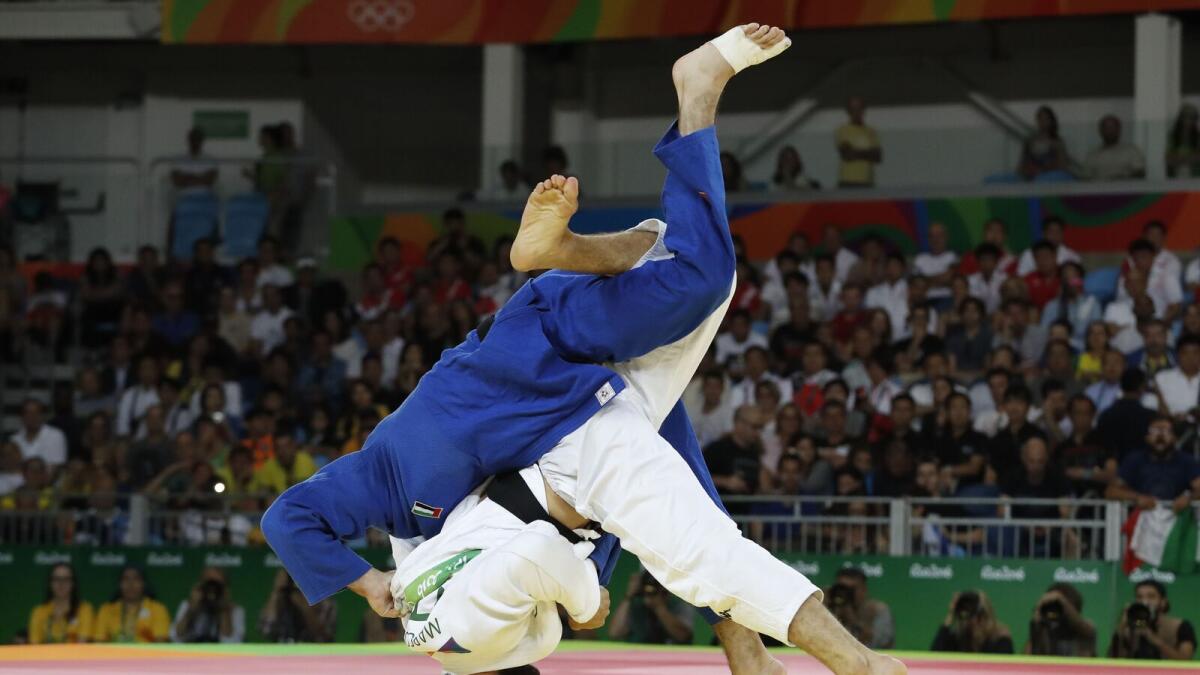 UAE’s Sergiu Toma (blue) competes with Italy’s Matteo Marconcini during their men’s 81kg judo contest bronze medal match during the Rio 2016 Olympic Games. — AFP