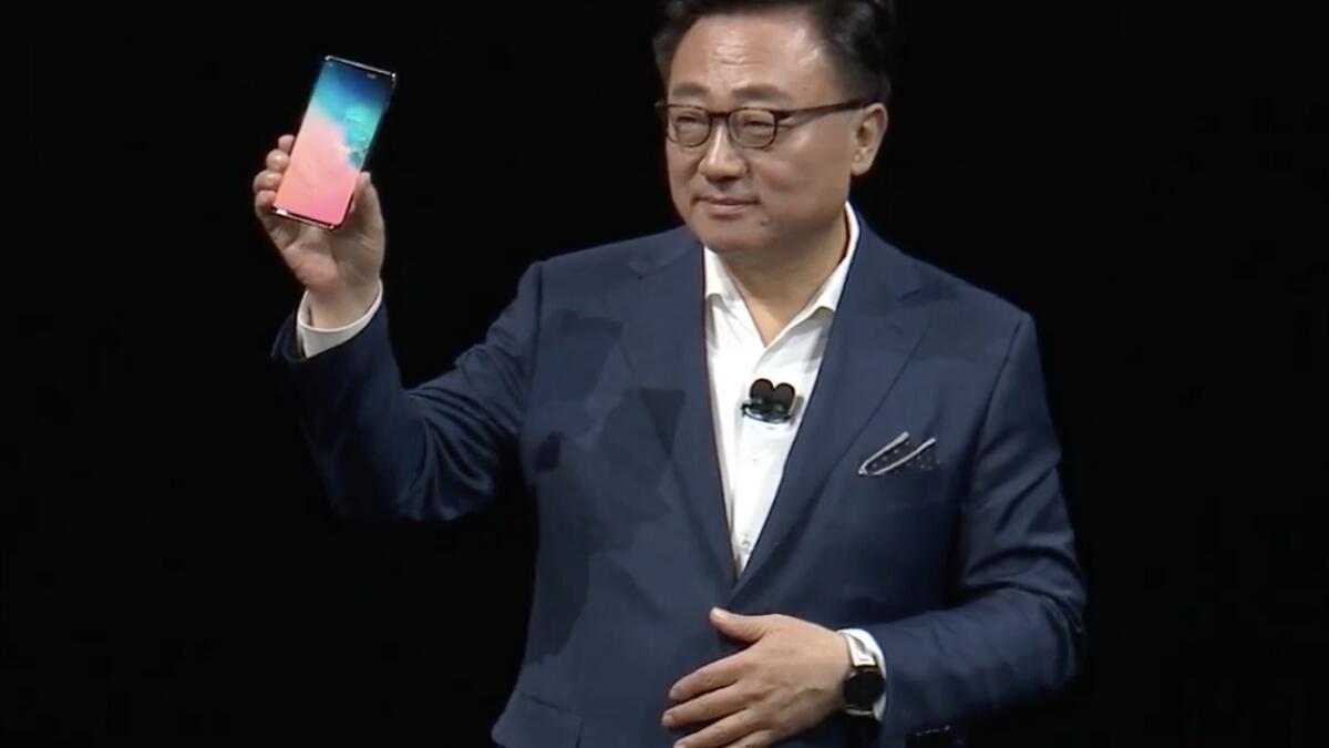 D.J. Koh, president and CEO of Samsung's IT and mobile communications division, unveiling the Samsung Galaxy S10 at Unpacked 2019 in San Francisco on Wednesday.