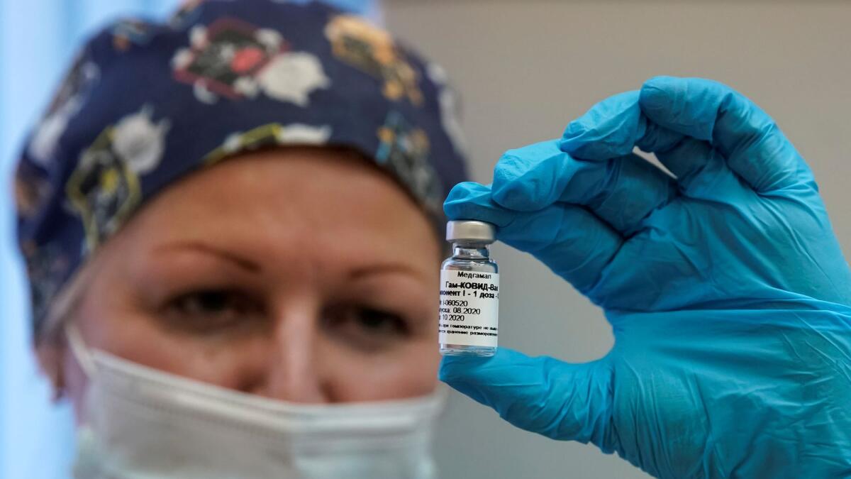 A nurse shows Russia's 'Sputnik-V' vaccine against the coronavirus disease (COVID-19) prepared for inoculation in a post-registration trials stage at a clinic in Moscow, Russia September 17, 2020.