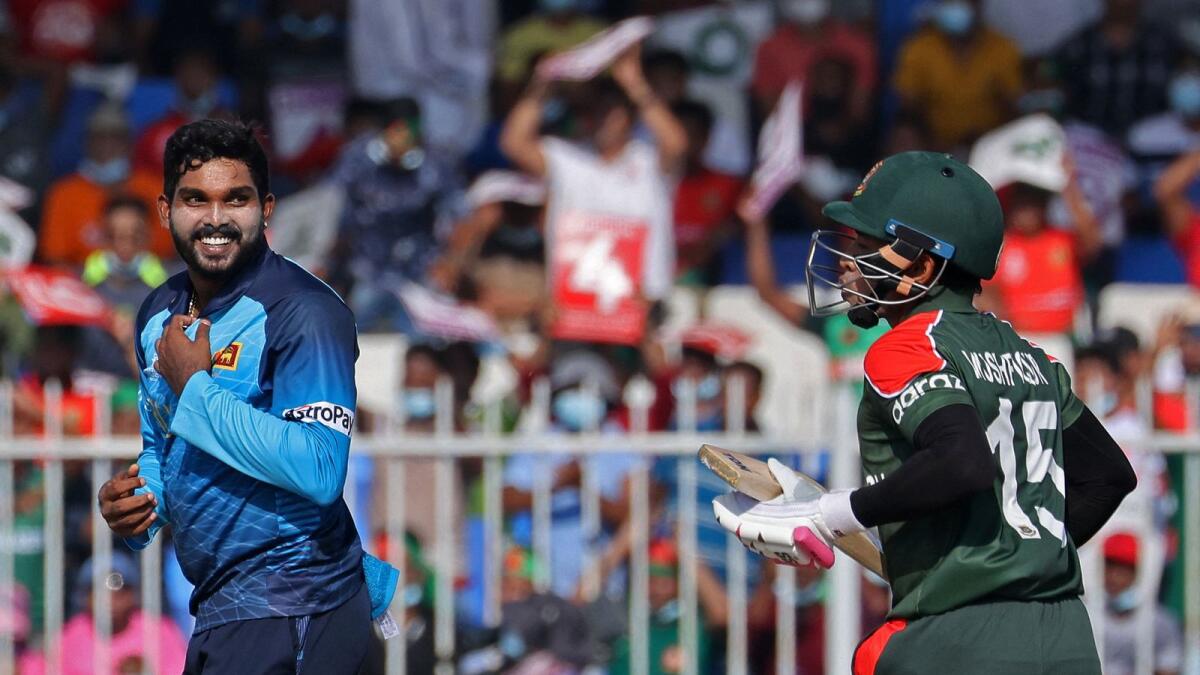 Sri Lanka's Wanindu Hasaranga (left) during the match against Bangladesh. (AFP)
