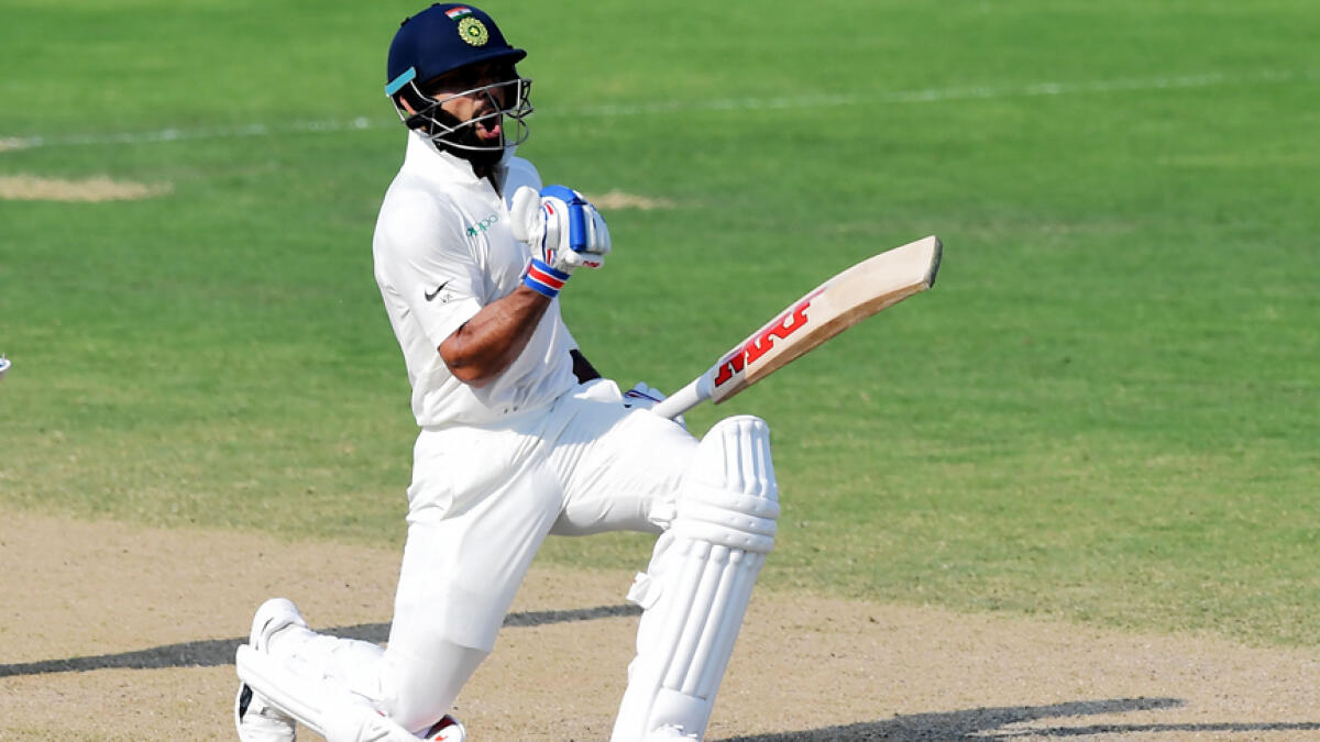 Kohli slams record ton as Lanka survive scare in drawn Test