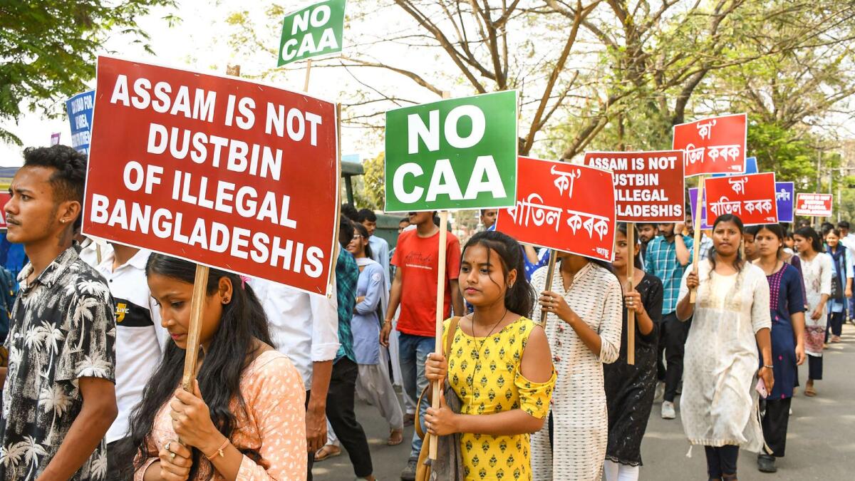 Activists of All Assam Students' Union (AASU) along with other groups raise slogans during a protest against the implementation of the Citizenship (Amendment) Act (CAA), in Guwahati. — PTI