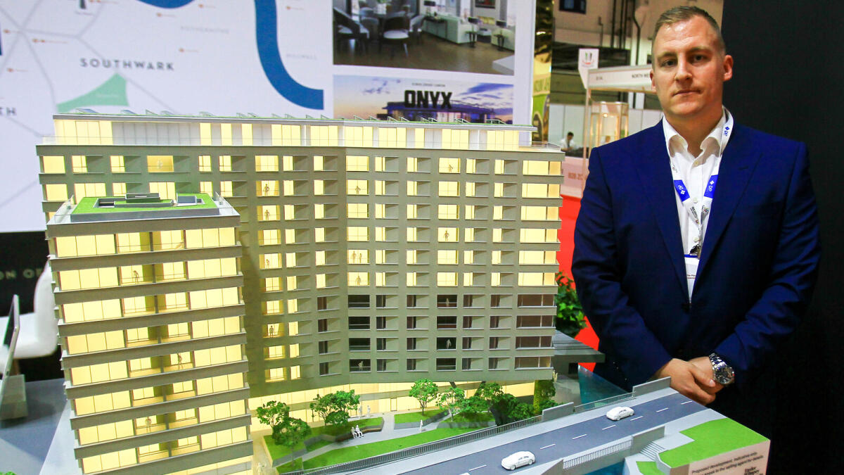 Darren McCormack with the model of Onyx Apartments at International Property Show.