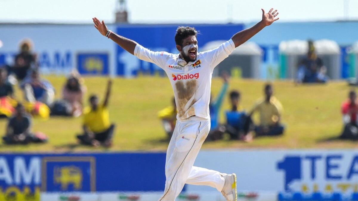 Sri Lanka's Ramesh Mendis celebrates after taking the wicket of Pakistan's Fawad Alam (not pictured) during the second day of the second Test in Galle on Monday. — AFP