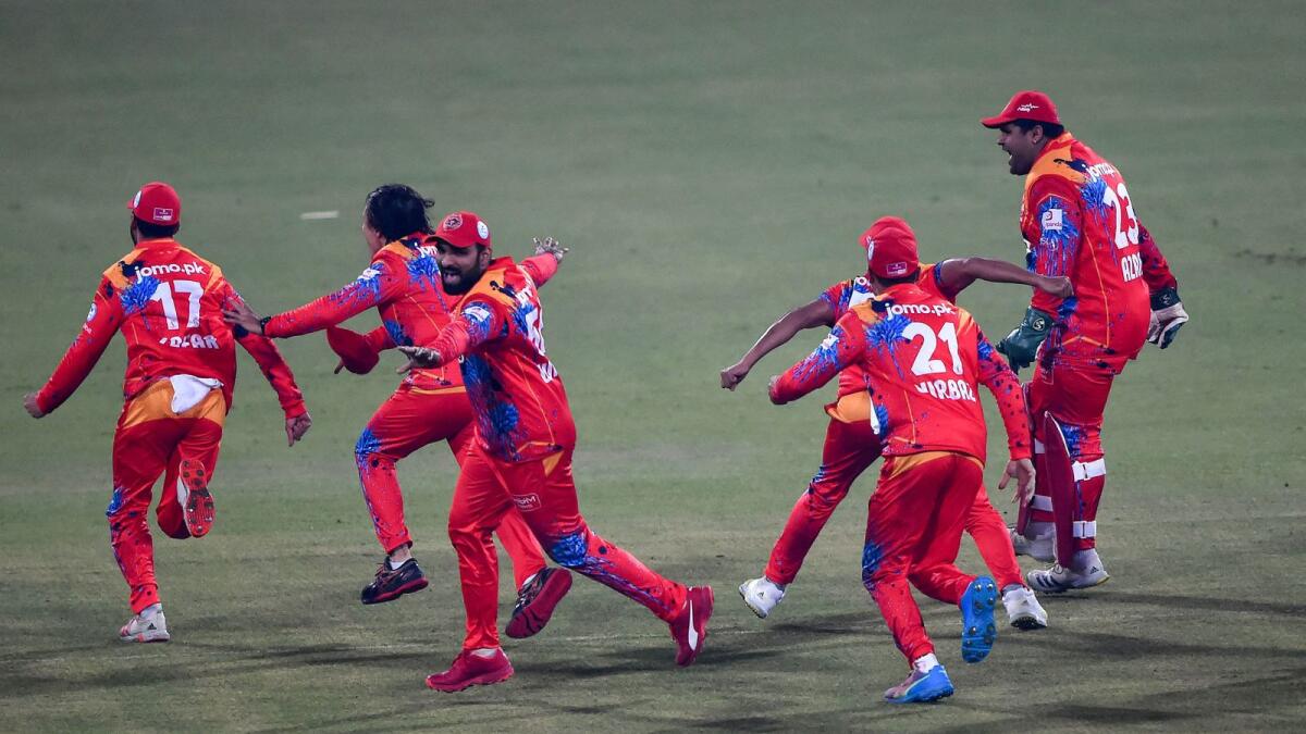 Islamabad United players celebrate after winning the match against Karachi Kings. (AFP)
