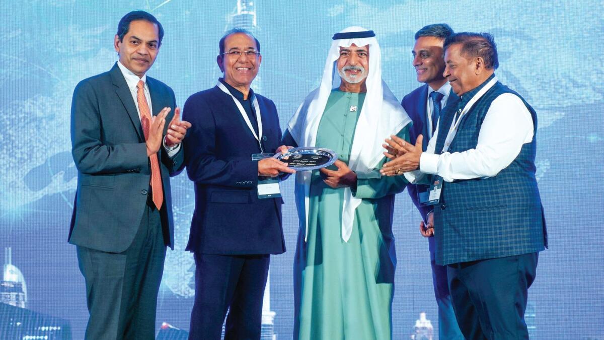 Sheikh Nahyan bin Mubarak Al Nahyan conferring the JINO Ratna award to Vinod Adani in the presence of Biren Jasani, JITO Dubai Chairman and Sukhraj Nahar, JITO Apex Chairman.