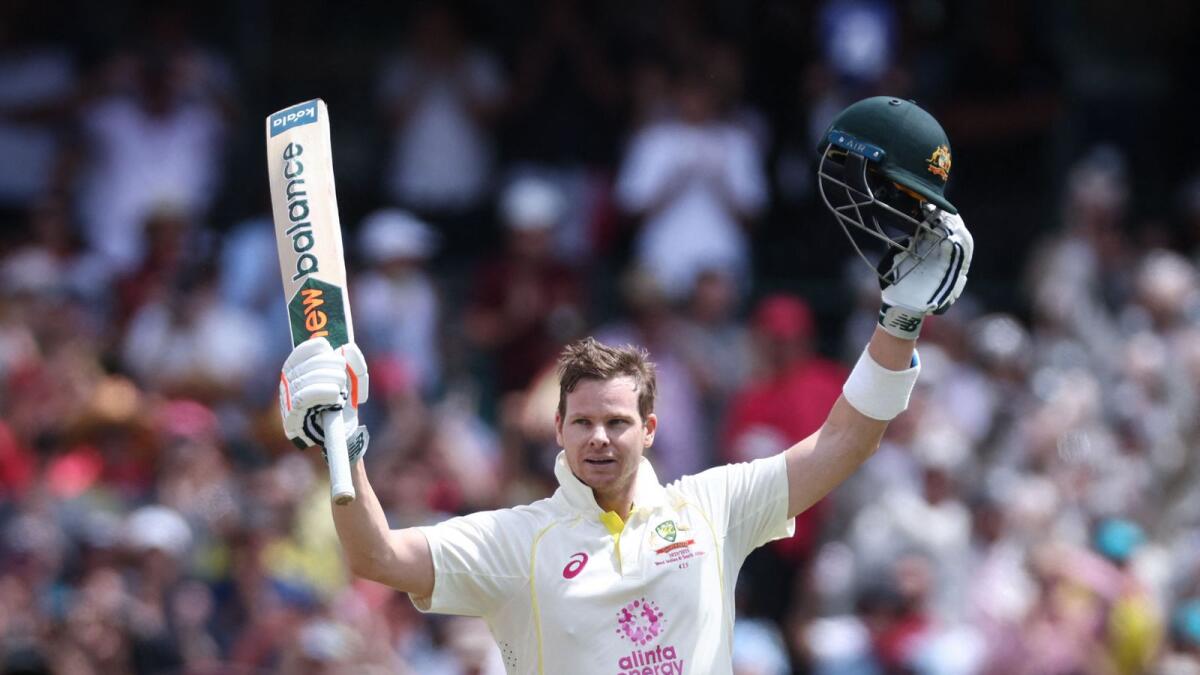 Australian batsman Steve Smith celebrates after reaching his century. — AFP