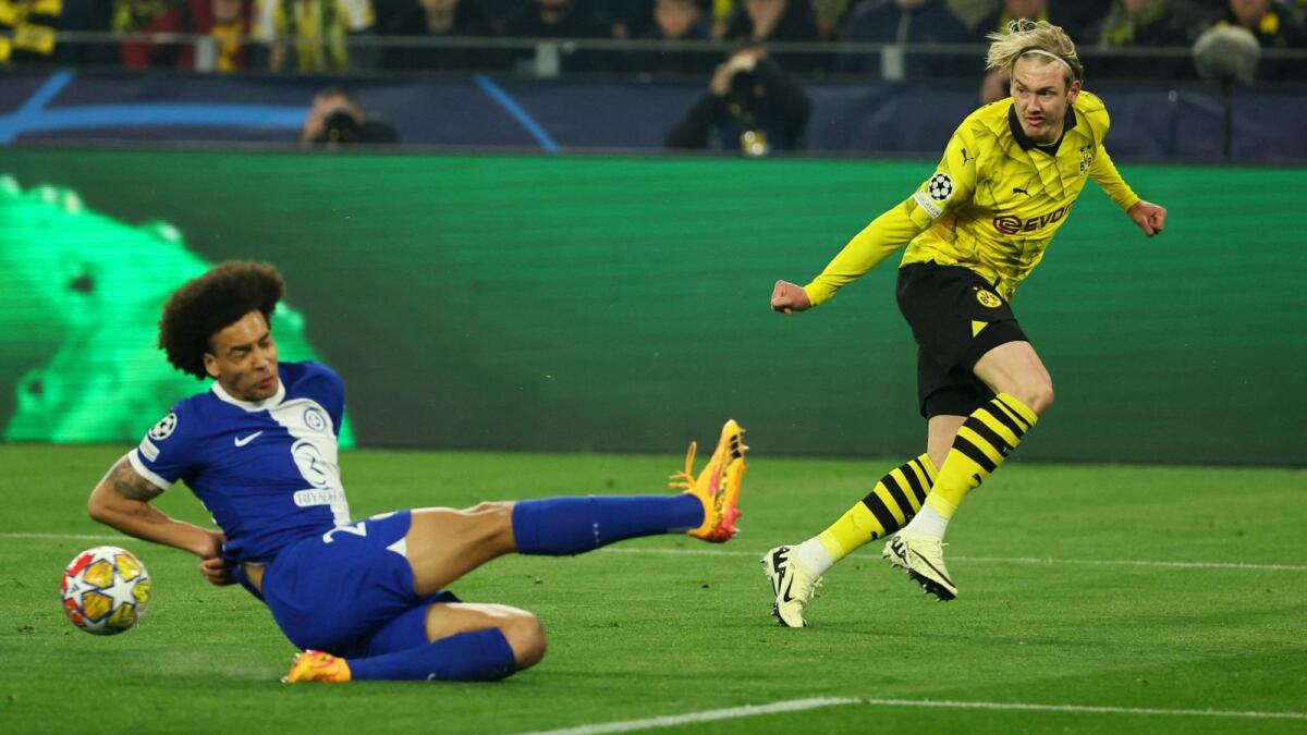 Borussia Dortmund's Julian Brandt in action with Atletico Madrid's Axel Witsel. - Reuters