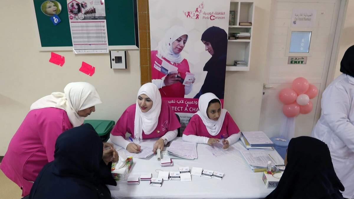 Hospital staff from Umm Al Quwain hospital interviewing patients at the Pink Caravan.-Photo by Leslie Pableo