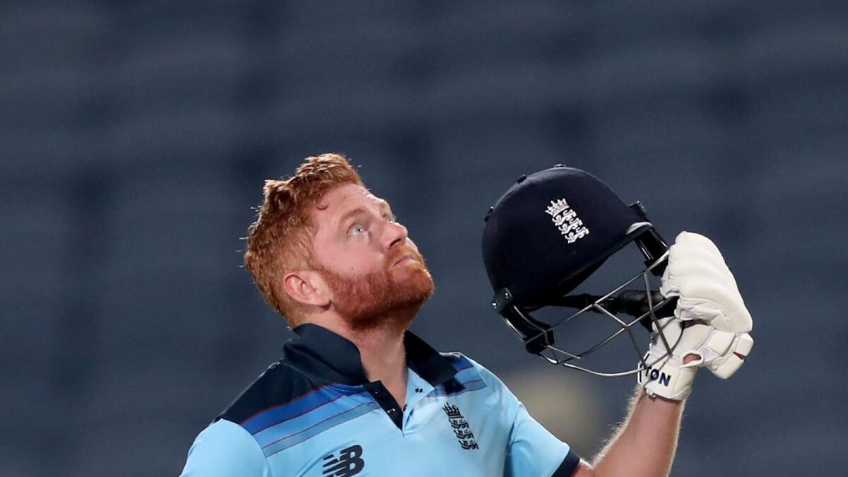 England's Jonny Bairstow looks skywards to celebrate his century during the second ODI against India. — AP