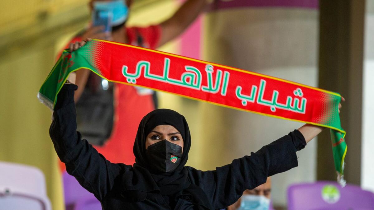 A fan cheers her team Shabab Al Ahli during the final. — Twitter