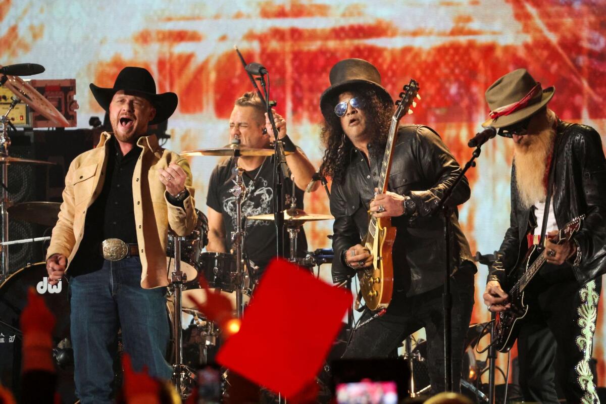 Cody Johnson, Billy Gibbons and Slash perform a tribute for Gary Rossington of the Lynyrd Skynyrd band