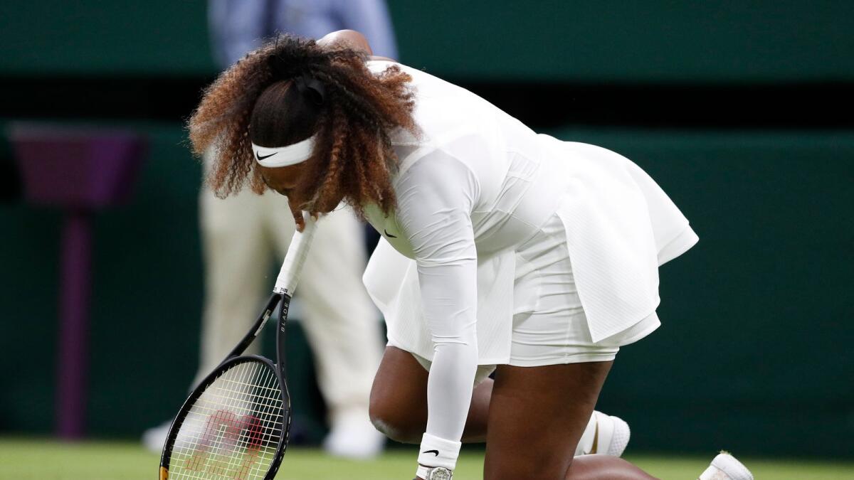 Serena Williams of the US reacts after suffering an injury during her first round match against  Belarus' Aliaksandra Sasnovich. (Reuters)