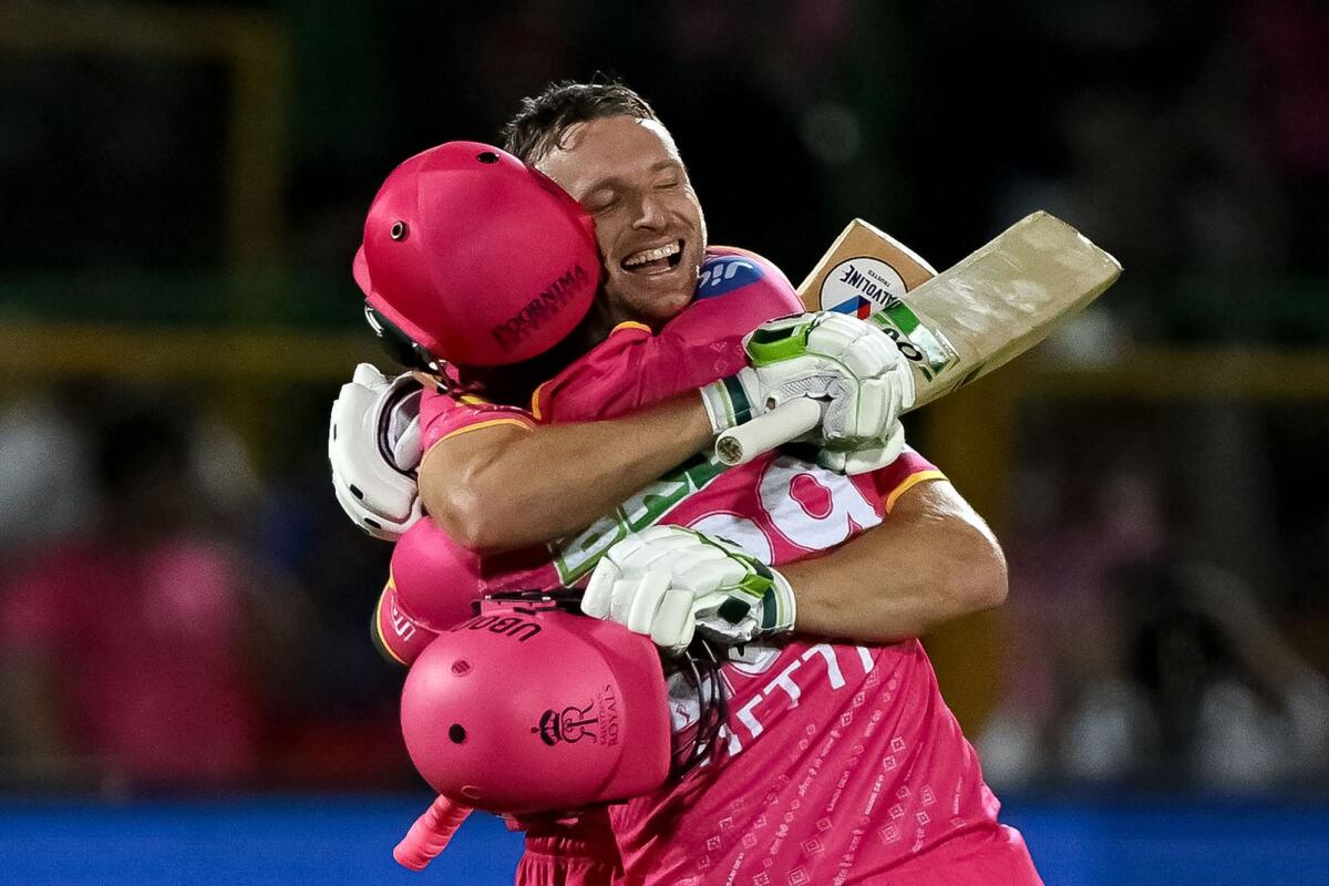 Rajasthan Royals' Jos Buttler (right) and Shimron Hetmyer celebrate their win over Royal Challengers Bengaluru. — AFP