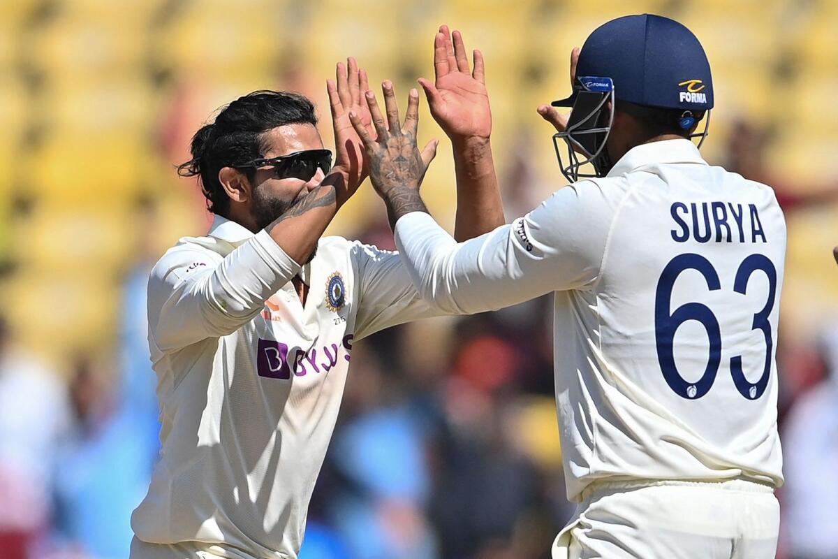 India's Ravindra Jadeja (left) celebrates with teammate Suryakumar Yadav after the dismissal of Australia's Matt Renshaw. — AFP