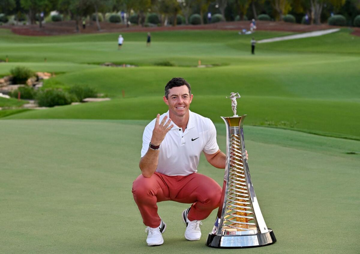 Rory McIlroy with the Race to Dubai trophy at the Jumeirah Golf Estates in Dubai on Sunday. — AFP