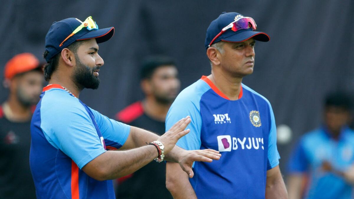 India's Rishabh Pant (left) speaks with coach Rahul Dravid during a practice session at the Arun Jaitley Stadium in New Delhi on Wednesday. — AFP