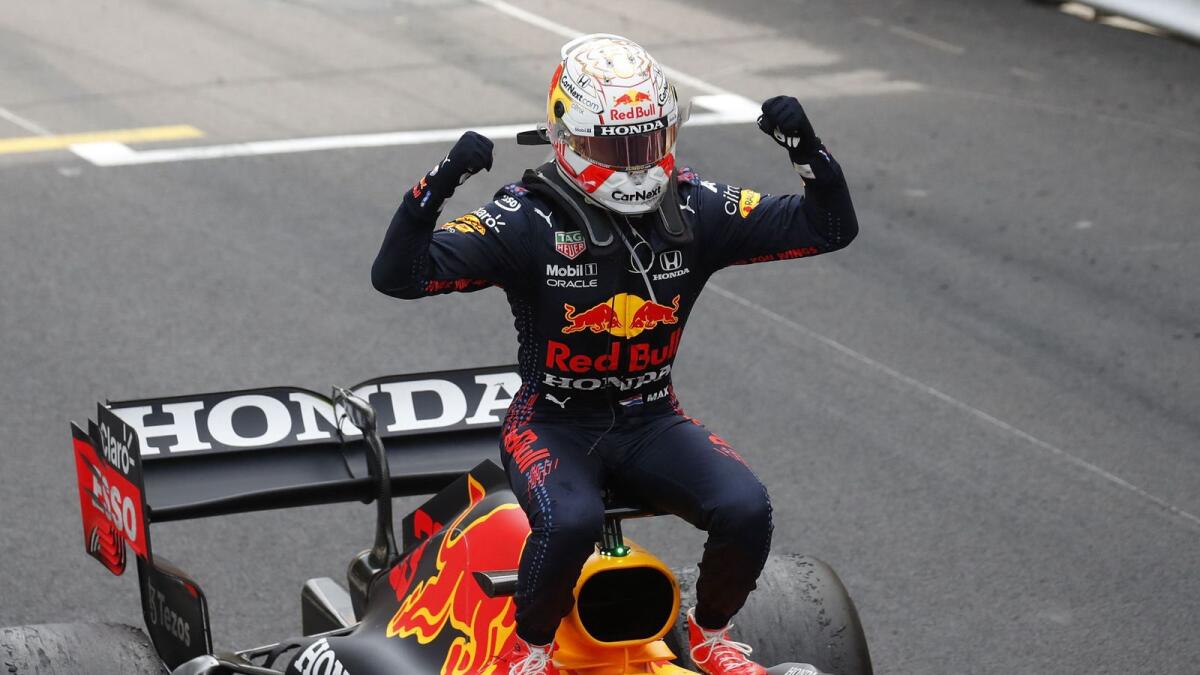 Red Bull's Dutch driver Max Verstappen celebrates after winning the Monaco Formula 1 Grand Prix. — AFP