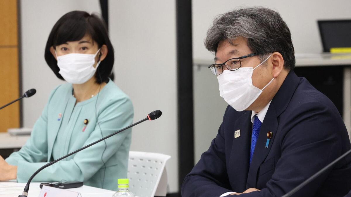 Japanese Education Minister Koichi Hagiuda (right) speaks while Olympic Minister Tamayo Marukawa (left) looks on during a meeting of the IOC Coordination Commission for the Tokyo 2020 Olympics in Tokyo. (AFP)