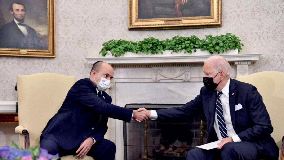 US President Joe Biden shakes hands with Israeli Prime Minister Naftali Bennett. — AFP file
