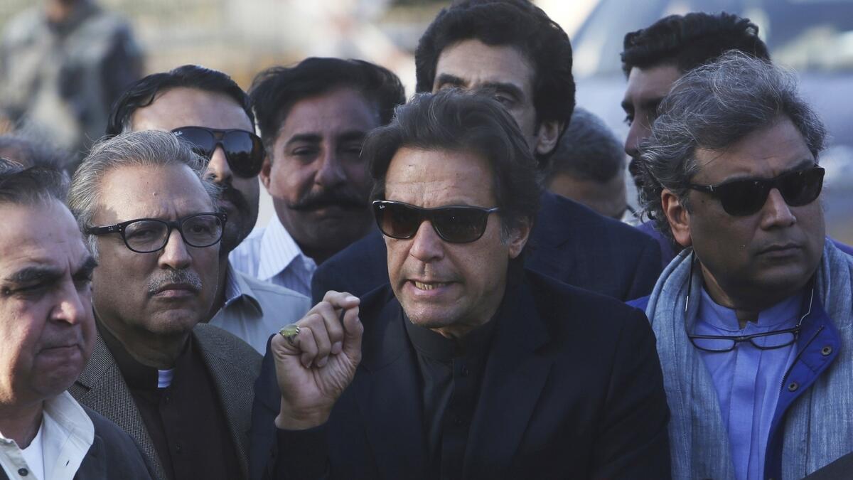 Pakistani opposition leader Imran Khan speaks to reporters in Karachi, Pakistan.-AP
