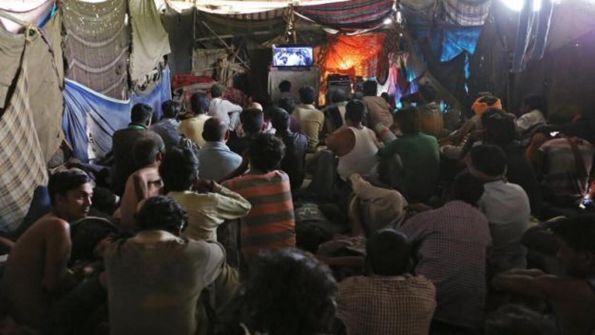 Cinema under a bridge provides Bollywood escape for poor