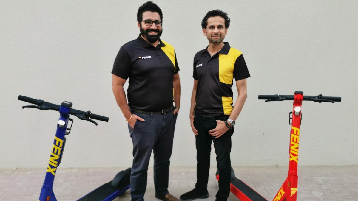 Fenix founders with scooters