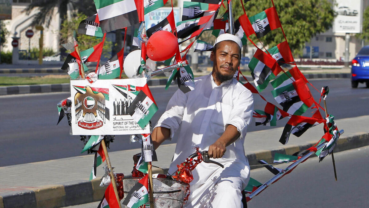 A man decorate his bicycle with UAE flags to celebrating 44 national day in Sharjah  on Wednesday  - Photo by M.Sajjad