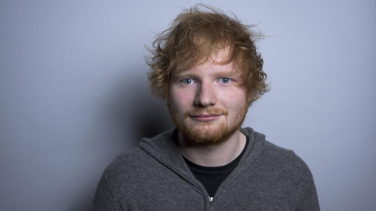 In this Friday, Oct. 16, 2015 photo, Ed Sheeran poses for a portrait in promotion of his full-length concert feature, 'Ed Sheeran: Jumpers for Goalposts,' in New York. The movie premieres in London this week.