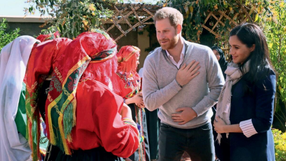 Prince Harry and Meghan during a visit to a boarding house for girls run by an NGO in Morocco. — Reuters