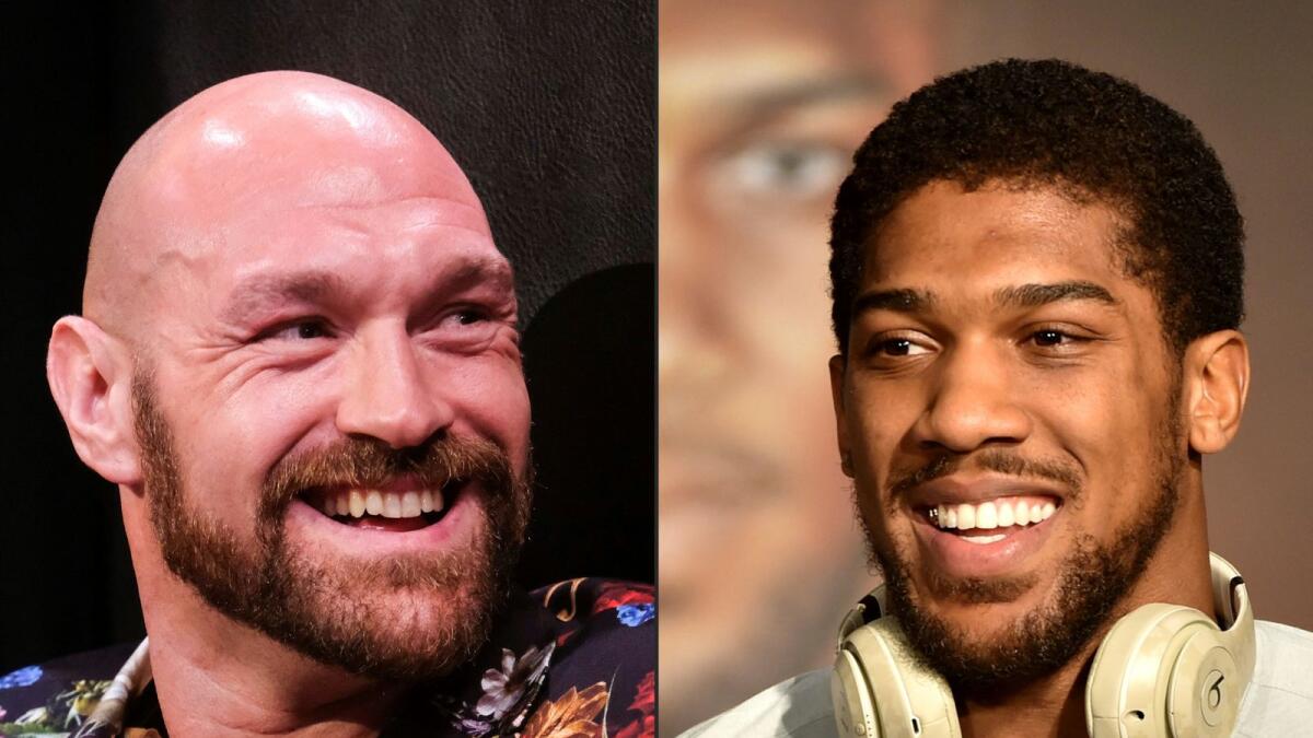 British heavyweight boxers Tyson Fury (left) and Anthony Joshua. (AFP)