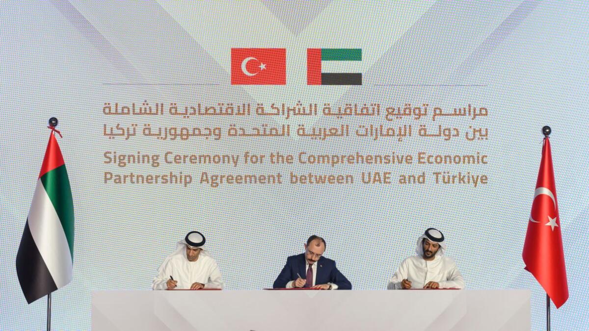 Abdulla bin Touq, UAE Minister of the Economy; Mehmet Muş, Minister of Trade of Türkiye  and Dr Thani bin Ahmed Al Zeyoudi, UAE Minister of State for Foreign Trade the UAE, sign the UAE -Türkiye Comprehensive Economic Partnership Agreement. — File photo