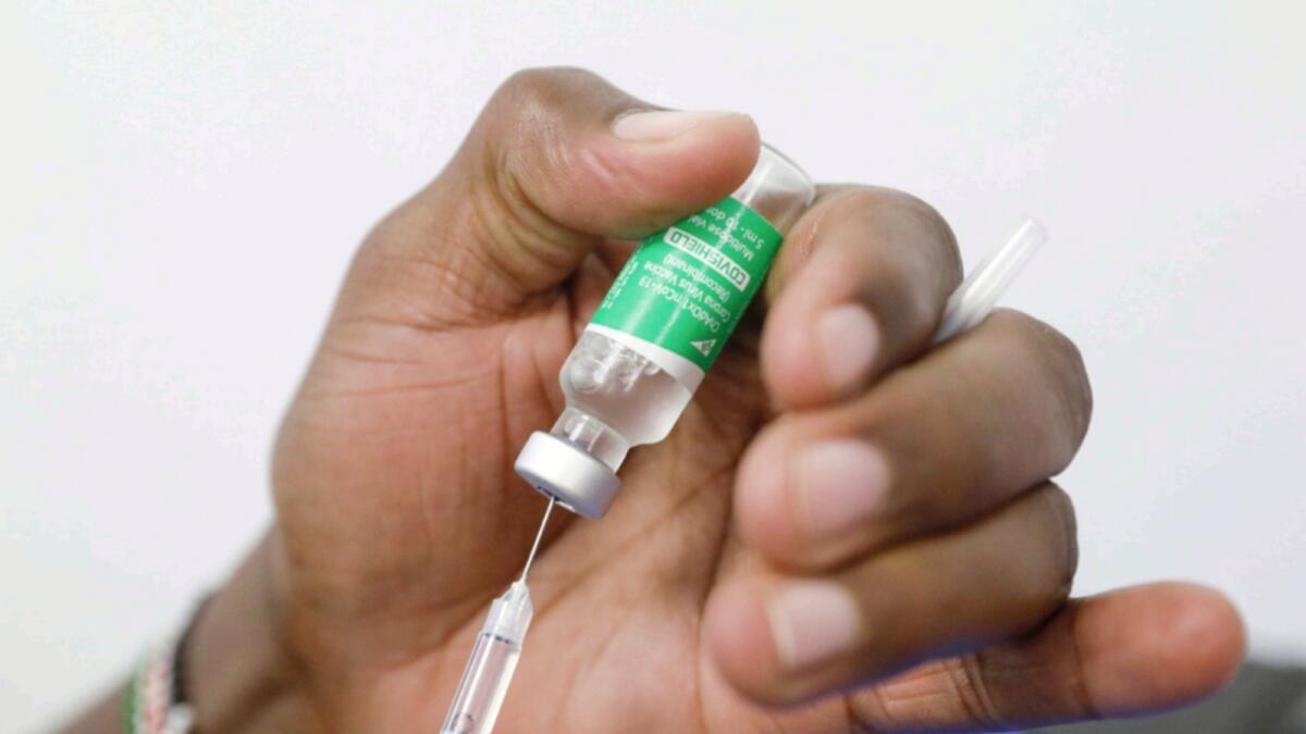 A medical worker prepares a dose of AstraZeneca's coronavirus vaccine in Nairobi, Kenya. — Reuters