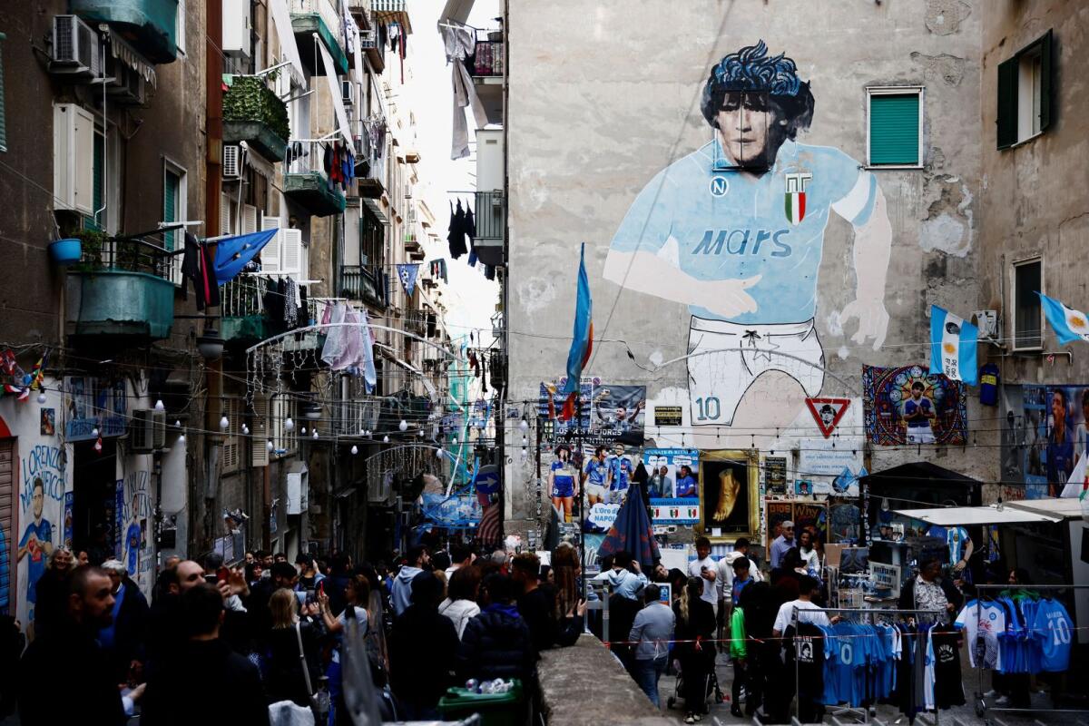 Flags, banners and a mural depicting late Argentinian football legend Diego Armando Maradona decorate the Spanish quarters as Naples paints the town for its potential first Scudetto championship win in 33 years. — Reuters