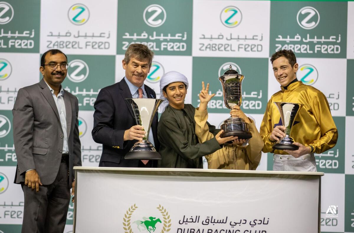 Trainer Simon Crisgord and the connections of Algiers on the podium at Meydan Racecourse. — DHRIC