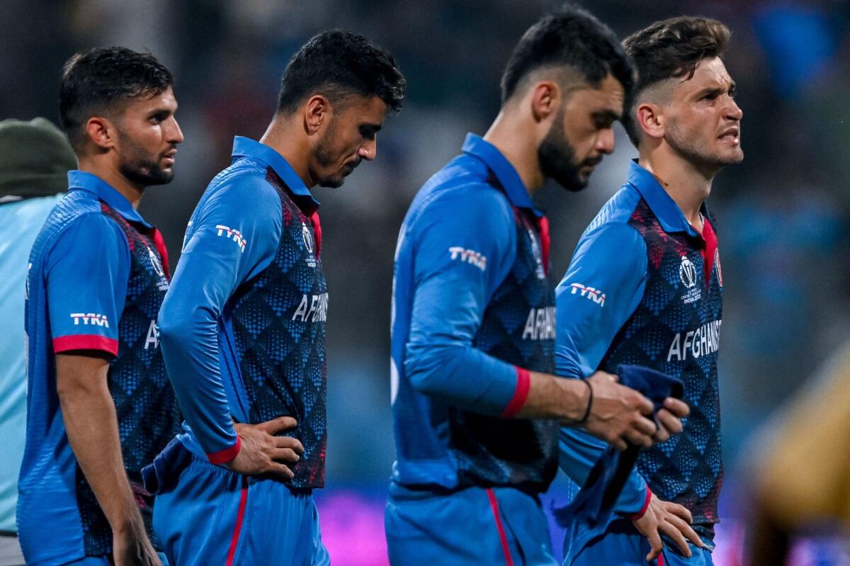 Afghanistan's players reacts after the defeat to Australia. — AFP