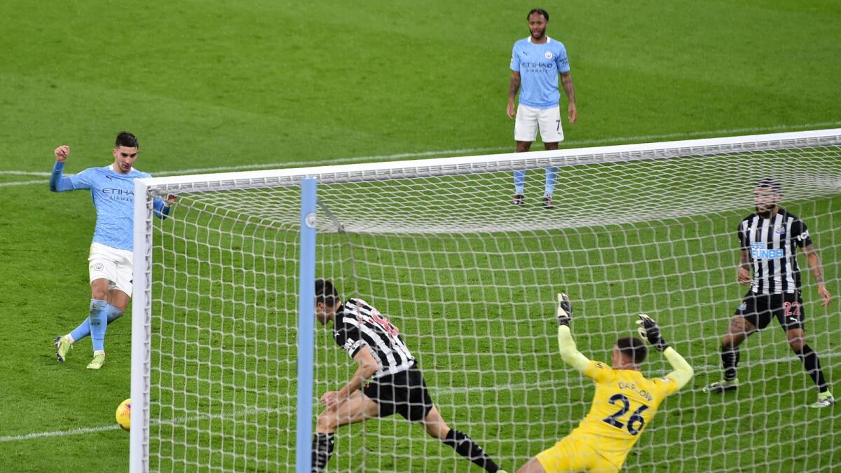 Manchester City's Ferran Torres scores a goal against Newcastle United during the  Premier League match. — AP