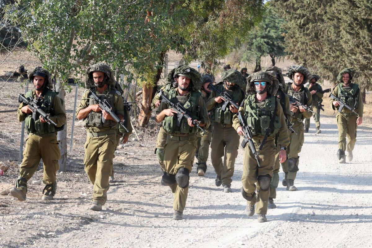 Israeli troops patrol at an undisclosed location along the border with the Gaza Strip. Photo: AFP