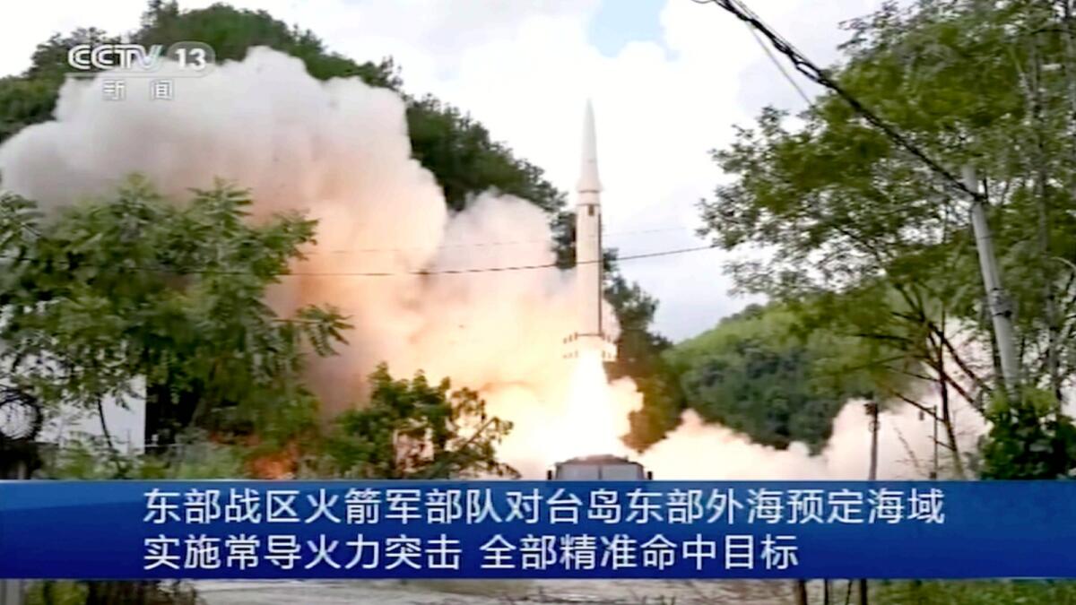 In this image taken from video footage run by China's CCTV, a projectile is launched from an unspecified location in China. — AP