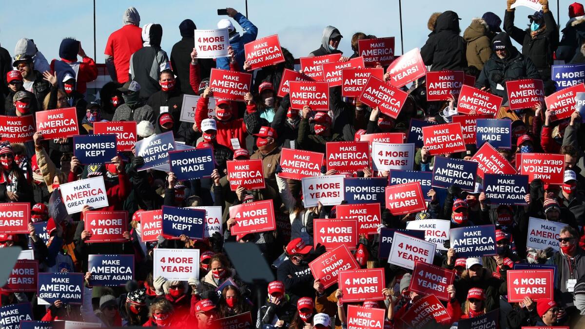 View of the crowd displaying signs of support ahead a campaign rally for U.S. President Donald Trump in Avoca, Pennsylvania, U.S., November 2, 2020.