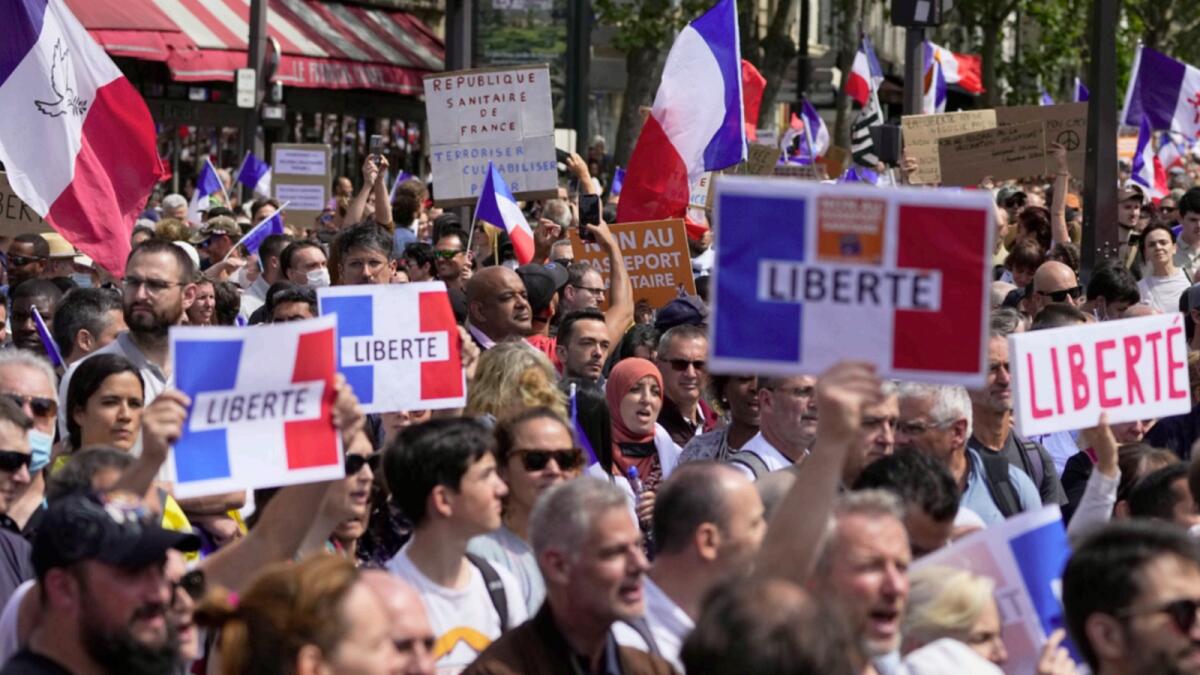 People protest against French government's Covid pass in Paris. — AP