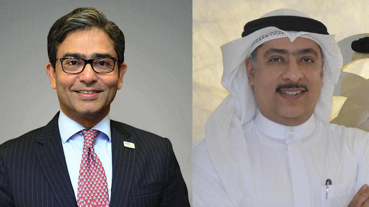 Noor Takaful CEO Rajesh Sethi and Ajman Bank CEO Mohamed Amiri.