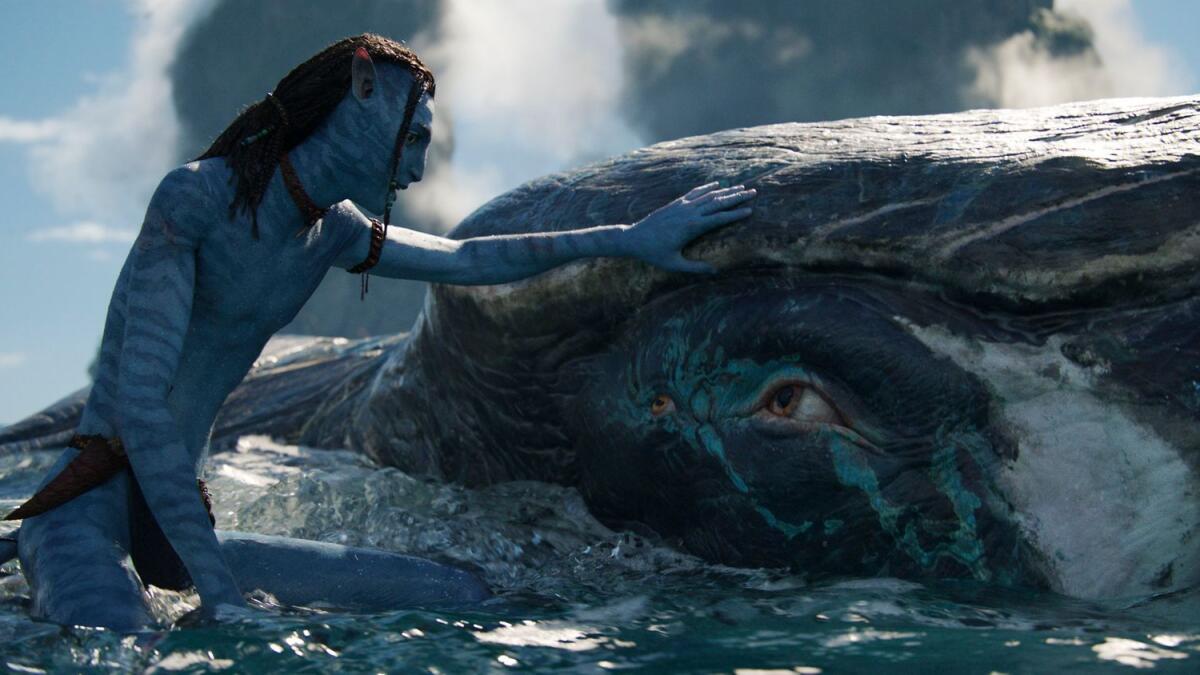 Lo'ak, voiced by Britain Dalton, and Tulkun in a scene from Avatar: The Way of Water (Photo: AP)