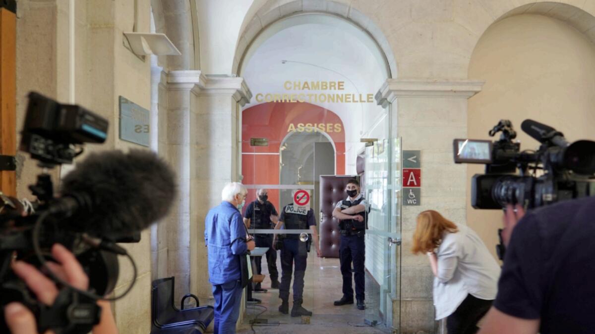 Reporters wait outside the courtroom as the 28-year-old man who slapped French President Emmanuel Macron is tried. — AP