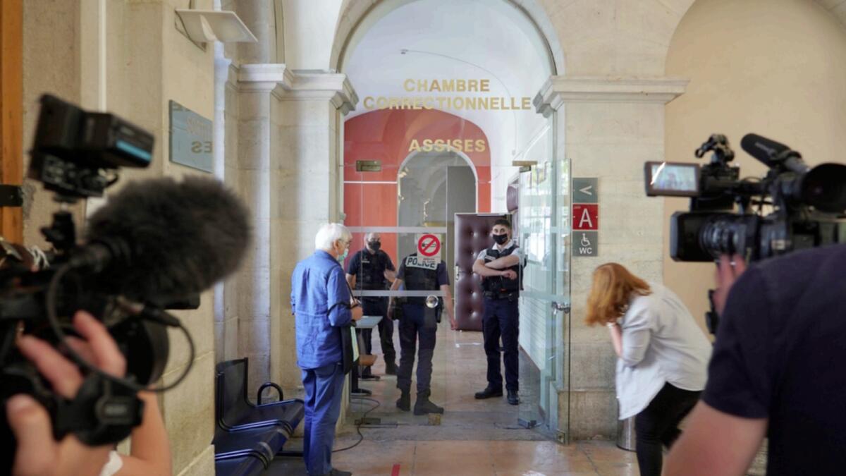 Reporters wait outside the courtroom as the 28-year-old man who slapped French President Emmanuel Macron is tried. — AP